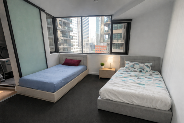 Modern high-rise bedroom with twin beds.png